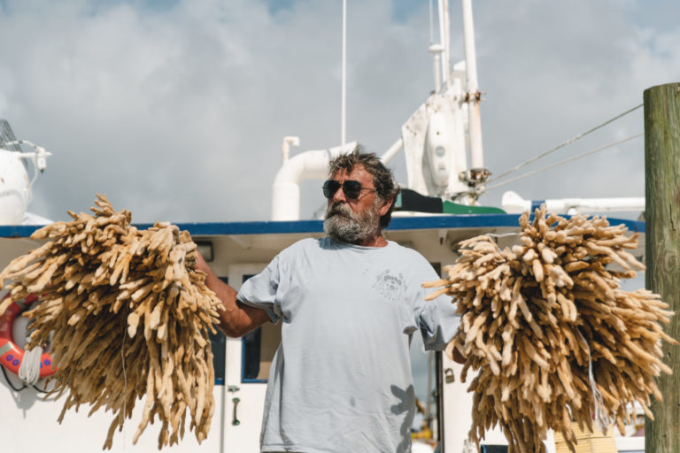 Sponger displaying his catch