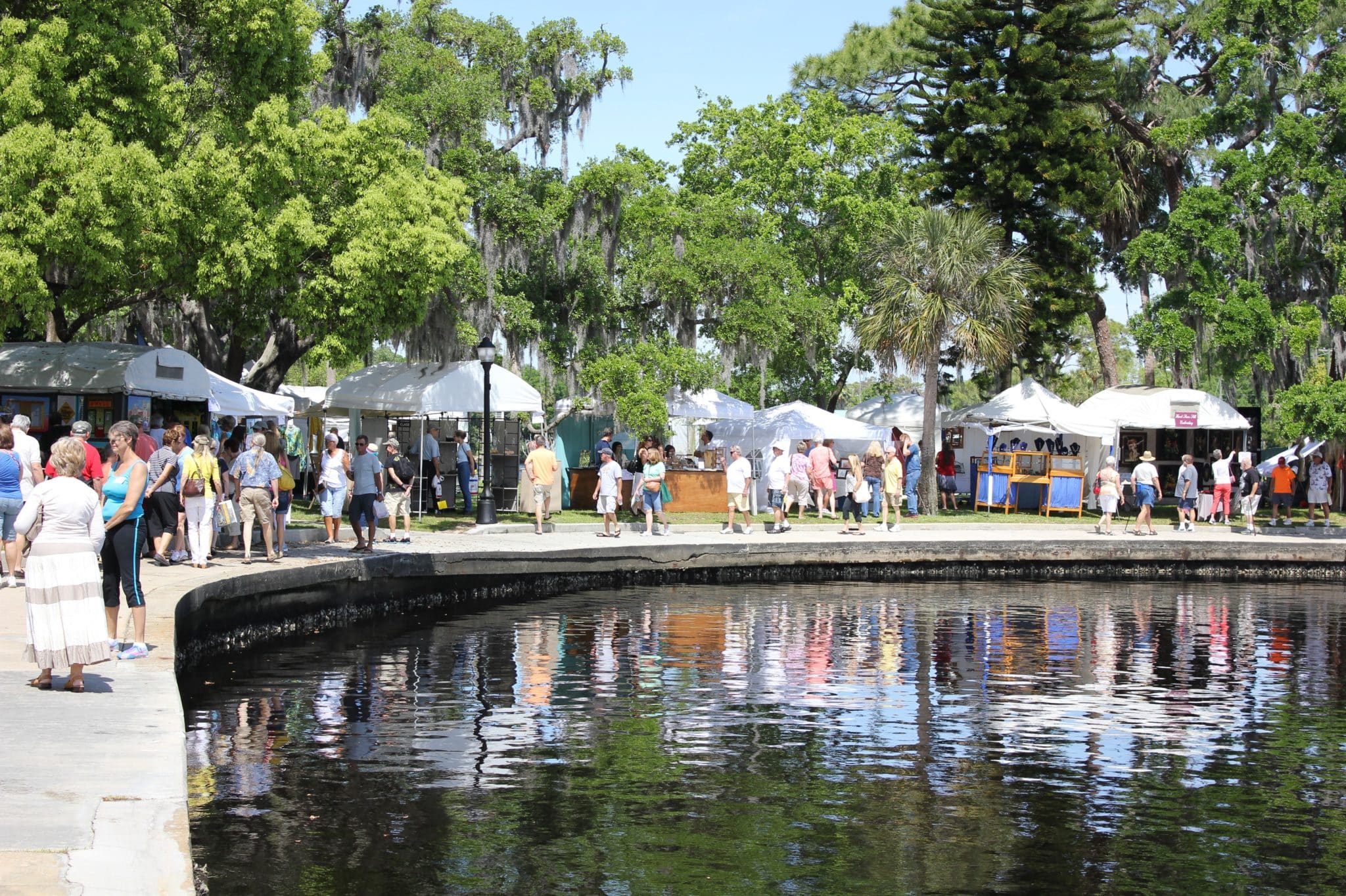 a crowd shot of people and tents at the Fine Arts Festival in Craig Park
