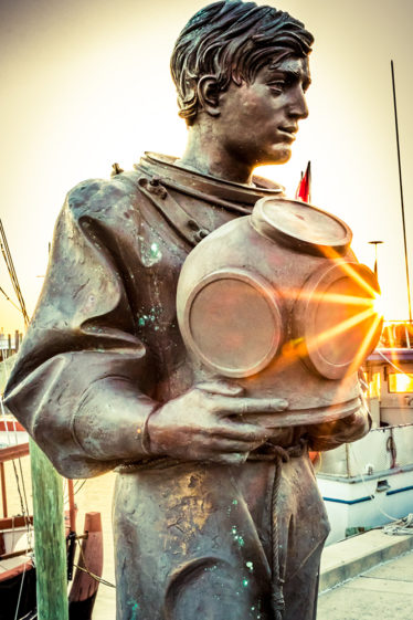 A popular photo opportunity is the bronze Sponge Diver on the World Famous Sponge Docks. Photo by Kevin Wodrich.