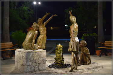 Glenna Goodacre's The Naiads, bronze statues at the Sponge Docks. Photo by Jackie Norcini.