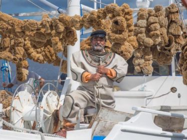 This sponge diver is very happy with his recent sponge haul.